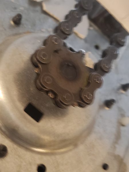 Stripped plastic drive gear pulled from a chain-drive garage door opener that was grinding in a Virginia Beach 23452 garage